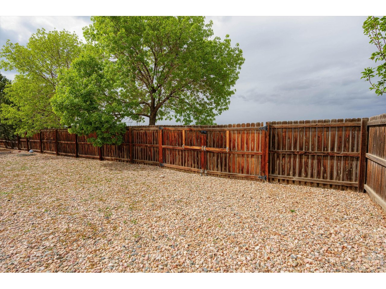 84 Pike Lane Severance, CO 80550 - Photo 8 of 34 a view of backyard with wooden fence