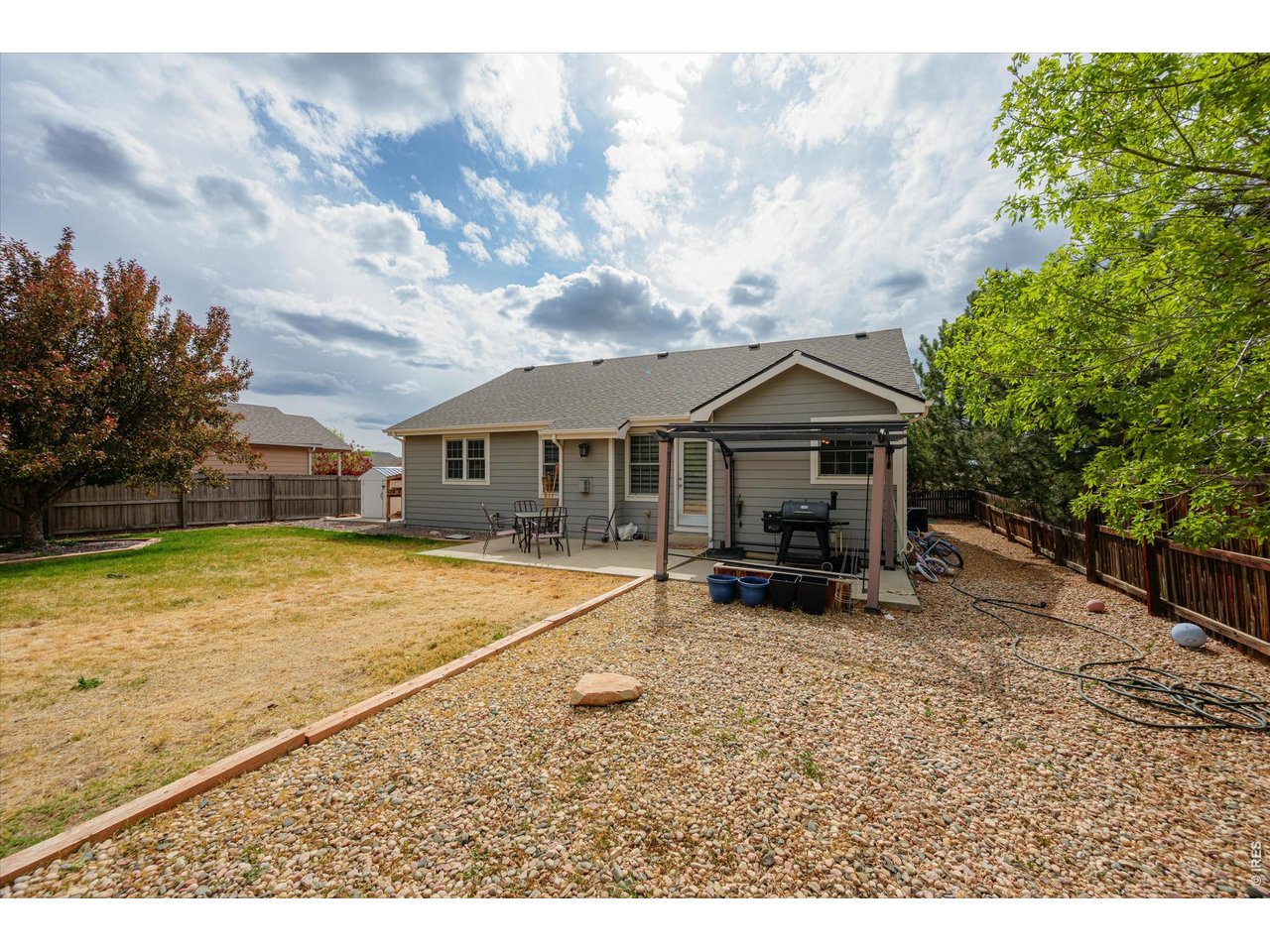 84 Pike Lane Severance, CO 80550 - Photo 10 of 34 a view of house with backyard and seating area