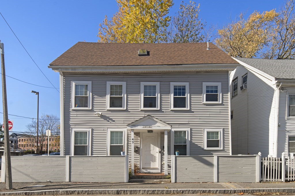 a front view of a house with glass windows