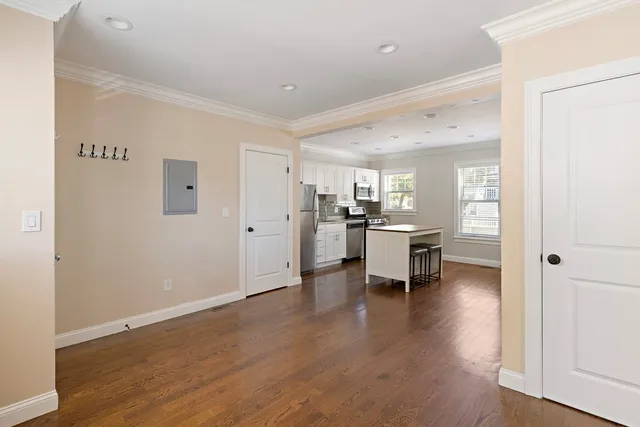 a kitchen with a refrigerator and a sink