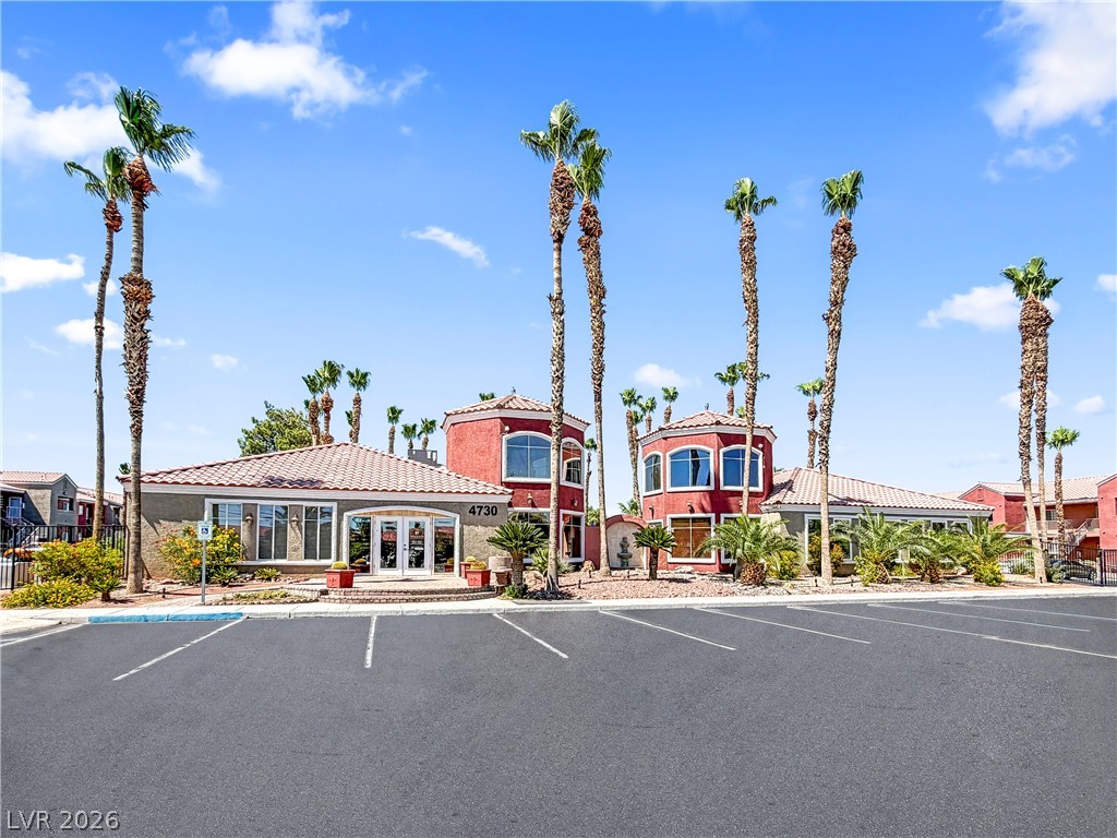 4730 East Craig Road, Unit 1053 Las Vegas, NV 89115 - Photo 31 of 32 Palm-lined community entry welcomes residents and guests to this vibrant complex.