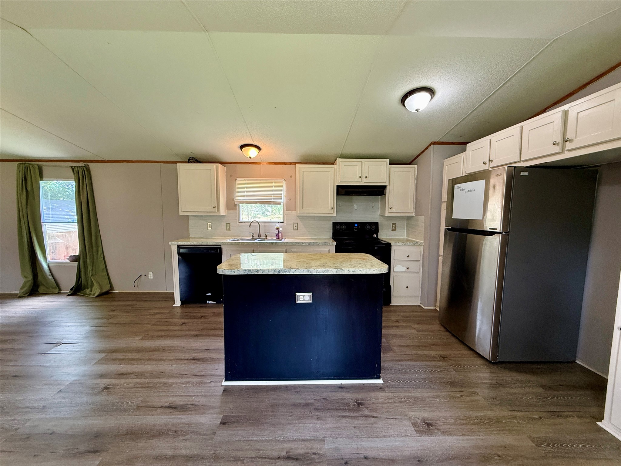 102 Western Way Angleton, TX 77515 - Photo 3 of 40 Seamless open kitchen, dining, living concept