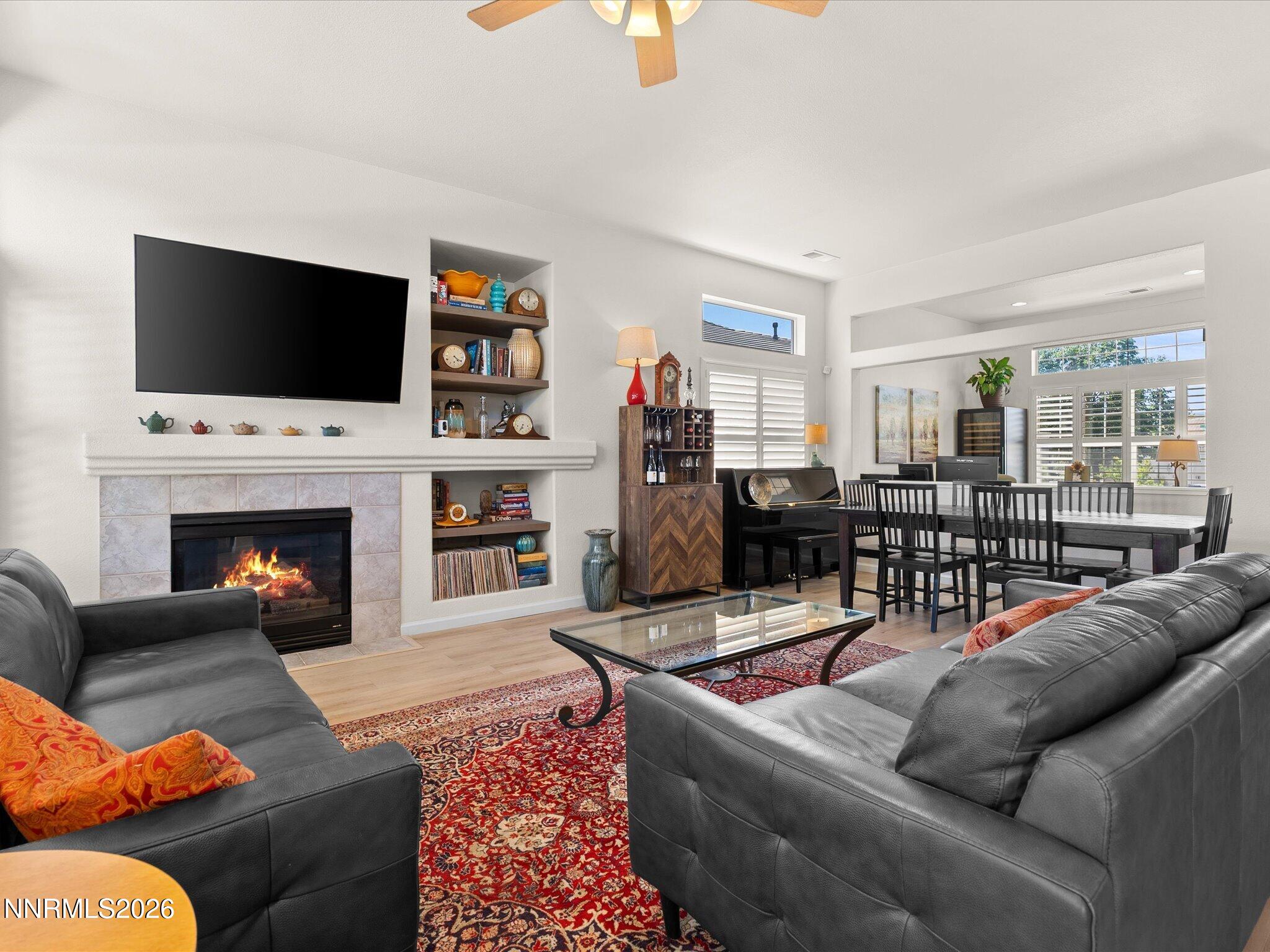 1275 Bernwood Court Reno, NV 89521 - Photo 7 of 19 a living room with furniture fireplace and flat screen tv