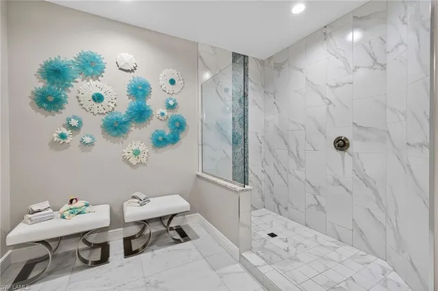 a bathroom with a toilet and a shower curtain