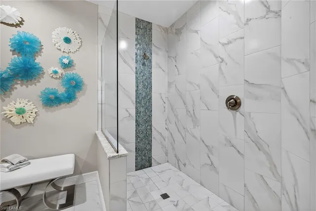 a hallway with white cabinets
