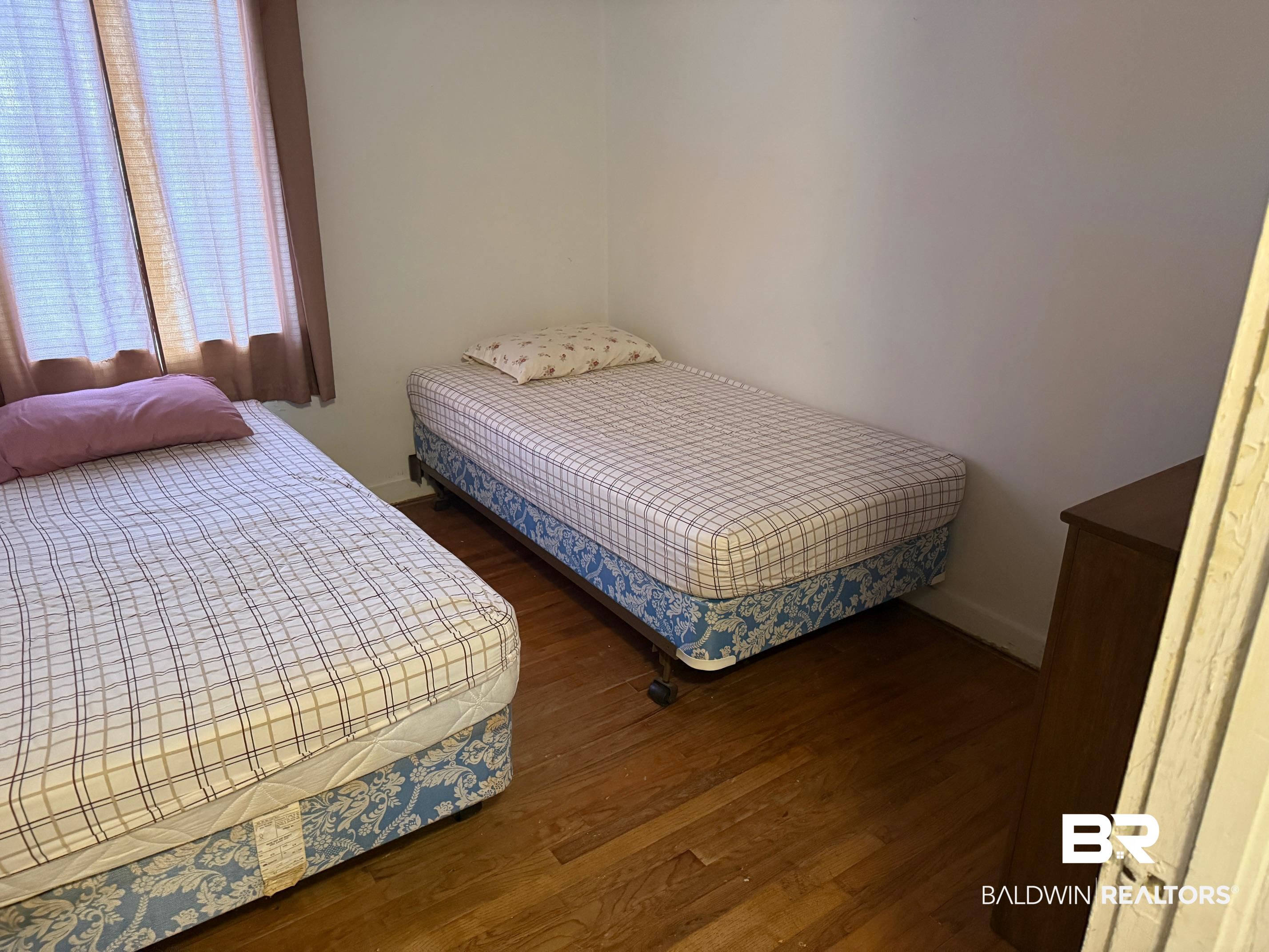 156 Pier Avenue Fairhope, AL 36532 - Photo 26 of 41 Bedroom featuring dark wood-style flooring
