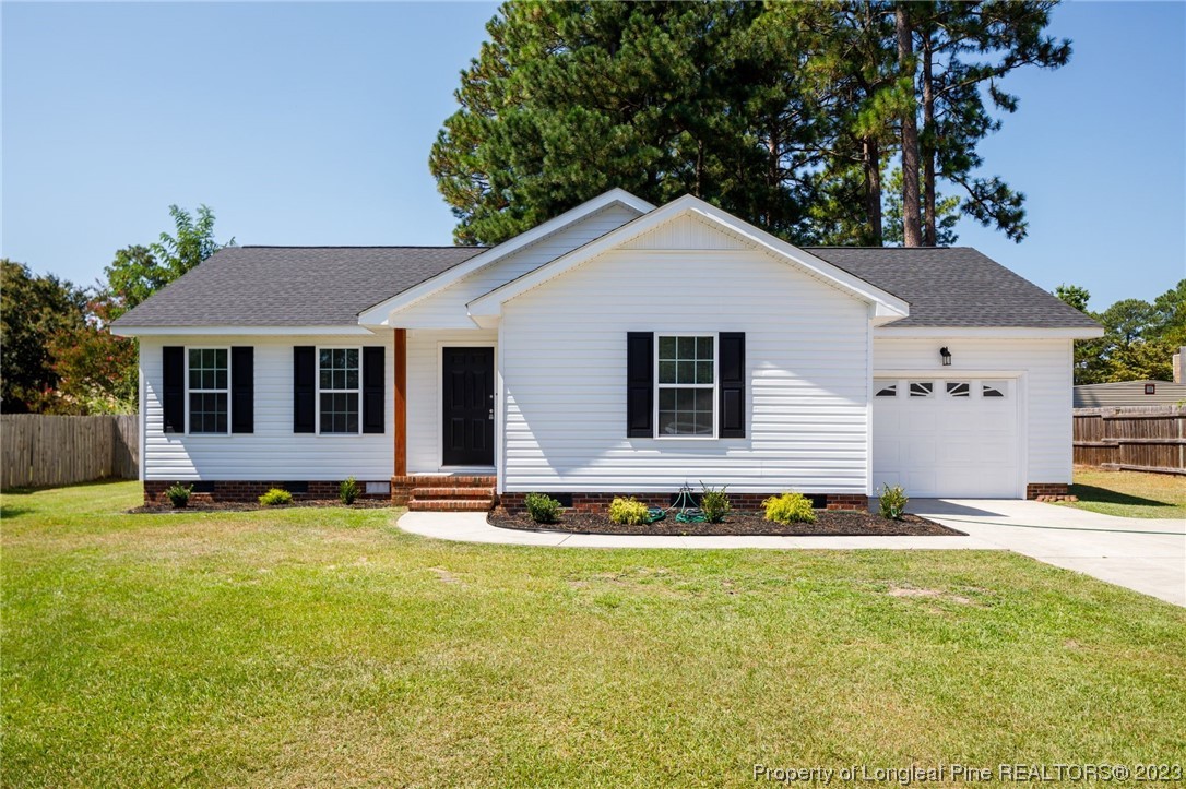942 Rim Road Fayetteville, NC 28314 - Photo 1 of 14 a front view of a house with a yard