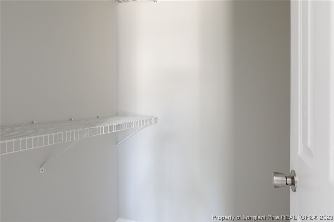 942 Rim Road Fayetteville, NC 28314 - Photo 9 of 14 a view of small space with racks on the wall