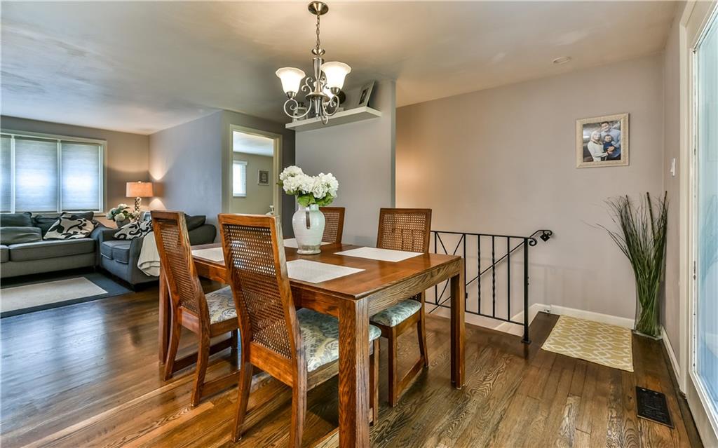 704 Flint Road Allison Park, PA 15101 - Photo 6 of 24 Nice Open Feel in the Dining Room and Living Room with stairs to Lower Level Family Room