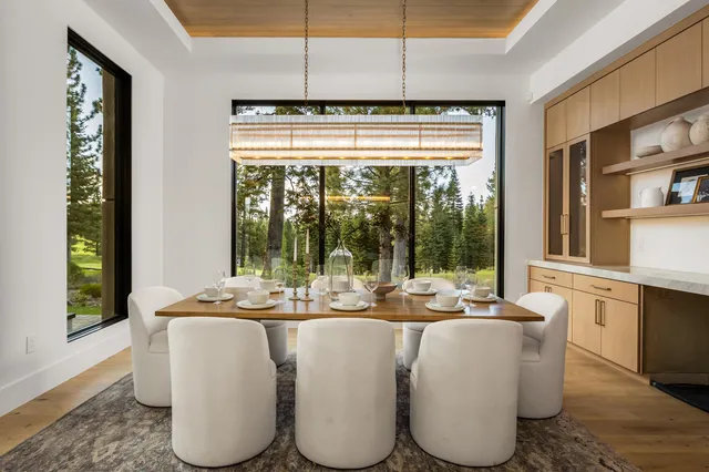 a dining room with large window