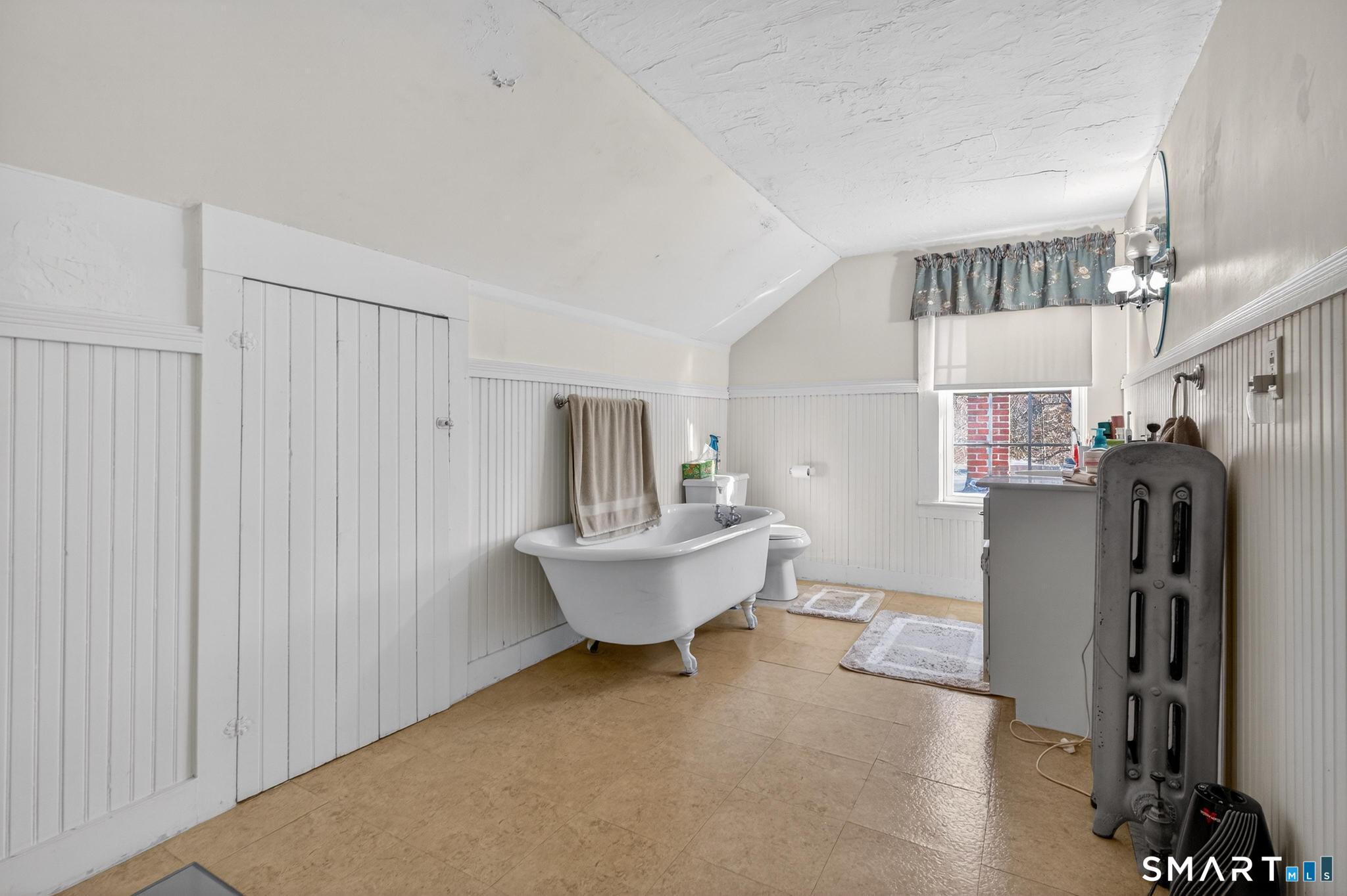 18 Broad Street Danielson, CT 06239 - Photo 11 of 38 a living room with furniture and a window