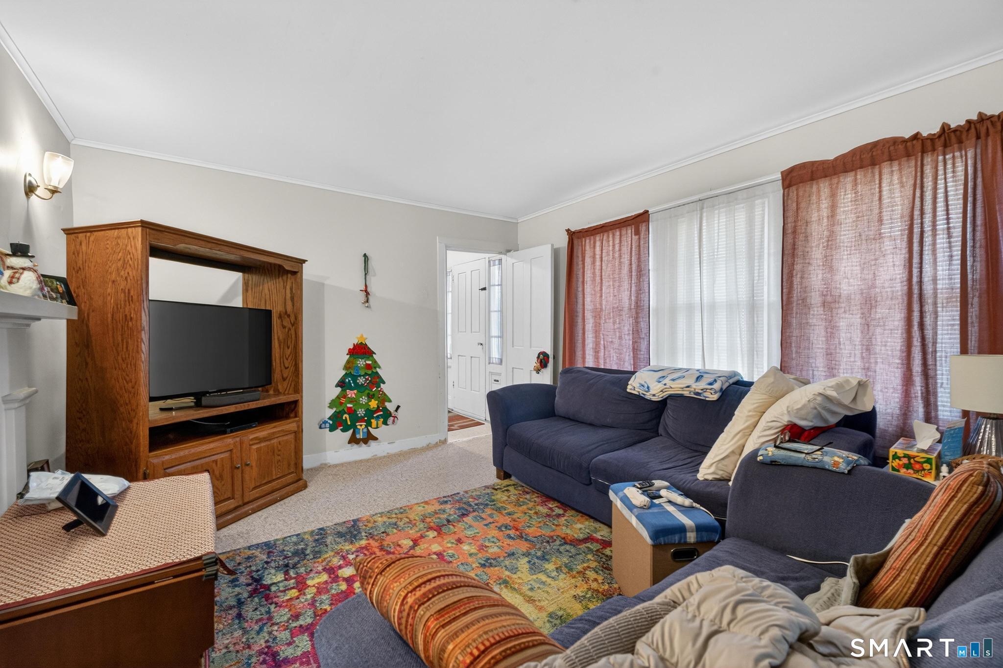 18 Broad Street Danielson, CT 06239 - Photo 20 of 38 a living room with furniture and a flat screen tv