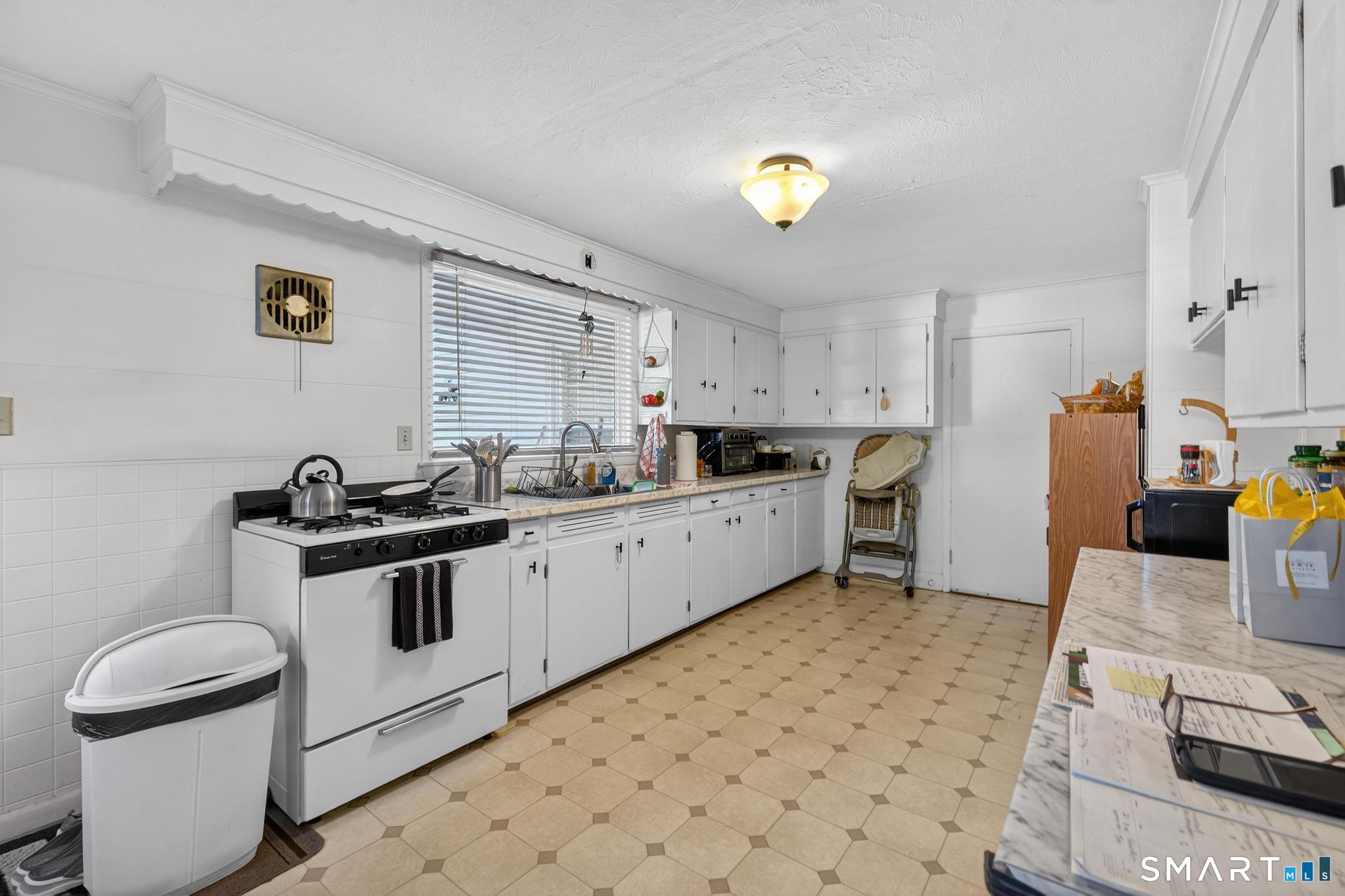 18 Broad Street Danielson, CT 06239 - Photo 23 of 38 a kitchen with a sink appliances and cabinets