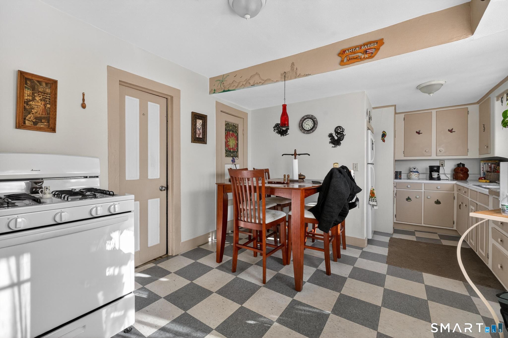 18 Broad Street Danielson, CT 06239 - Photo 29 of 38 a view of a dining room with furniture and chandelier