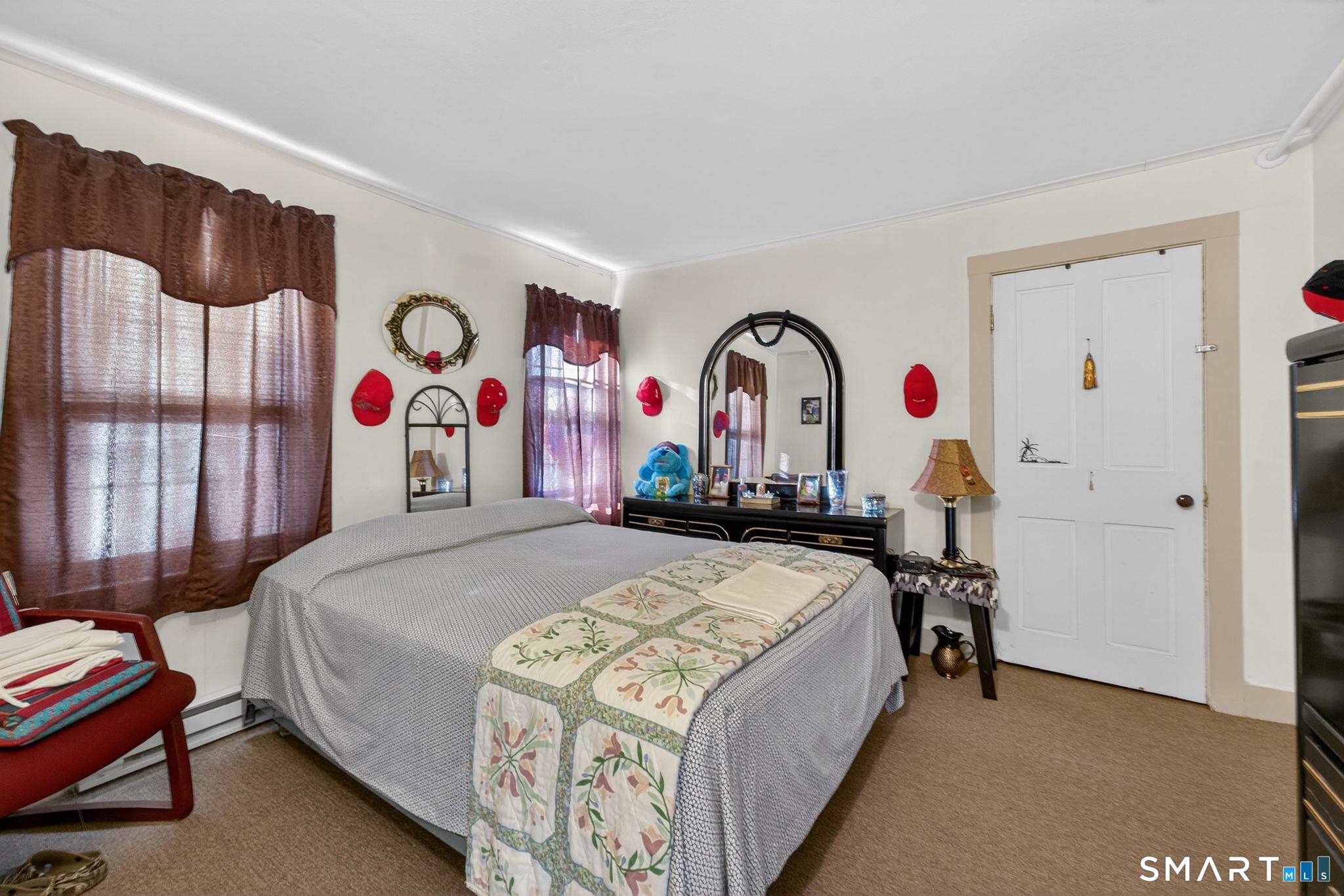 18 Broad Street Danielson, CT 06239 - Photo 33 of 38 a bed room with a bed and a desk