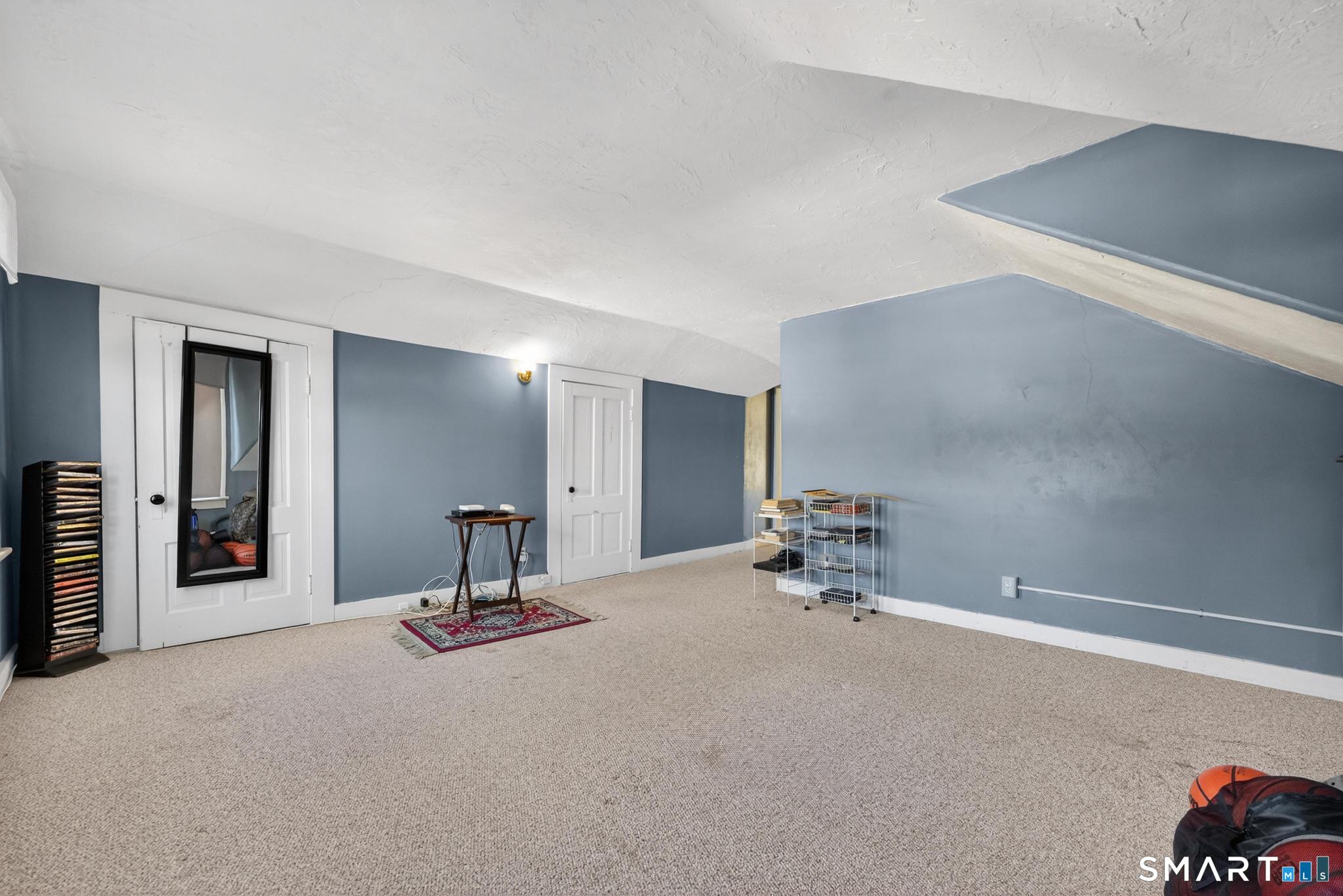 18 Broad Street Danielson, CT 06239 - Photo 9 of 38 a room with a table and a chair