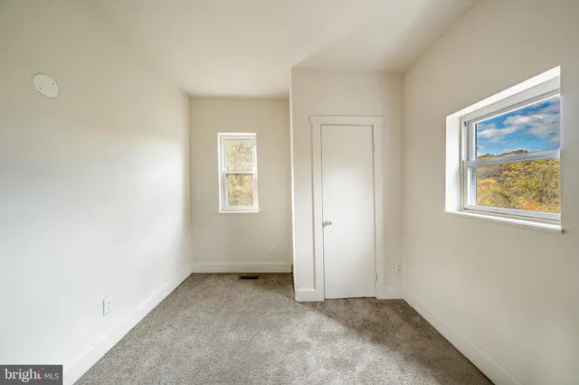 an empty room with windows