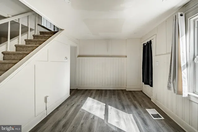 a view of entryway with wooden floor