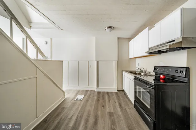 a view of a kitchen with electric appliances
