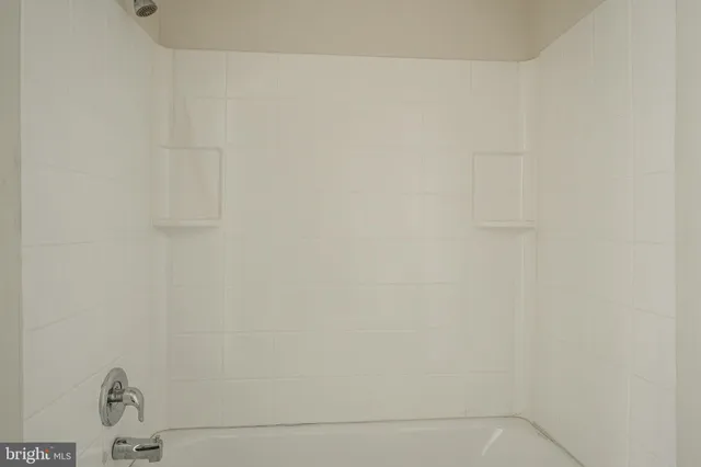 a close up of a white marble wall