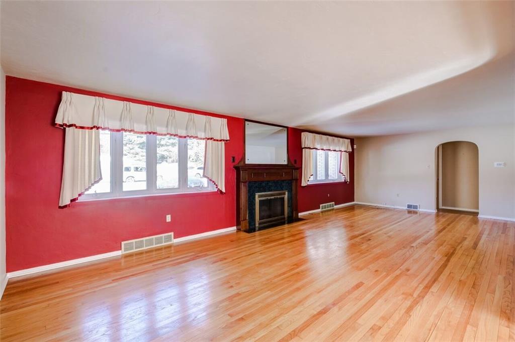 210 Crestmont Road Pittsburgh, PA 15237 - Photo 5 of 24 So much space in this living room that features hardwood floors and a fireplace too~