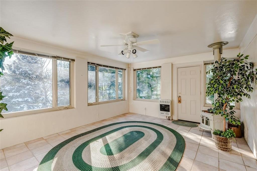 210 Crestmont Road Pittsburgh, PA 15237 - Photo 9 of 24 The main level sunroom is light and bright and can be used in most seasons. Includes a gas wall heater and wood burning stove.
