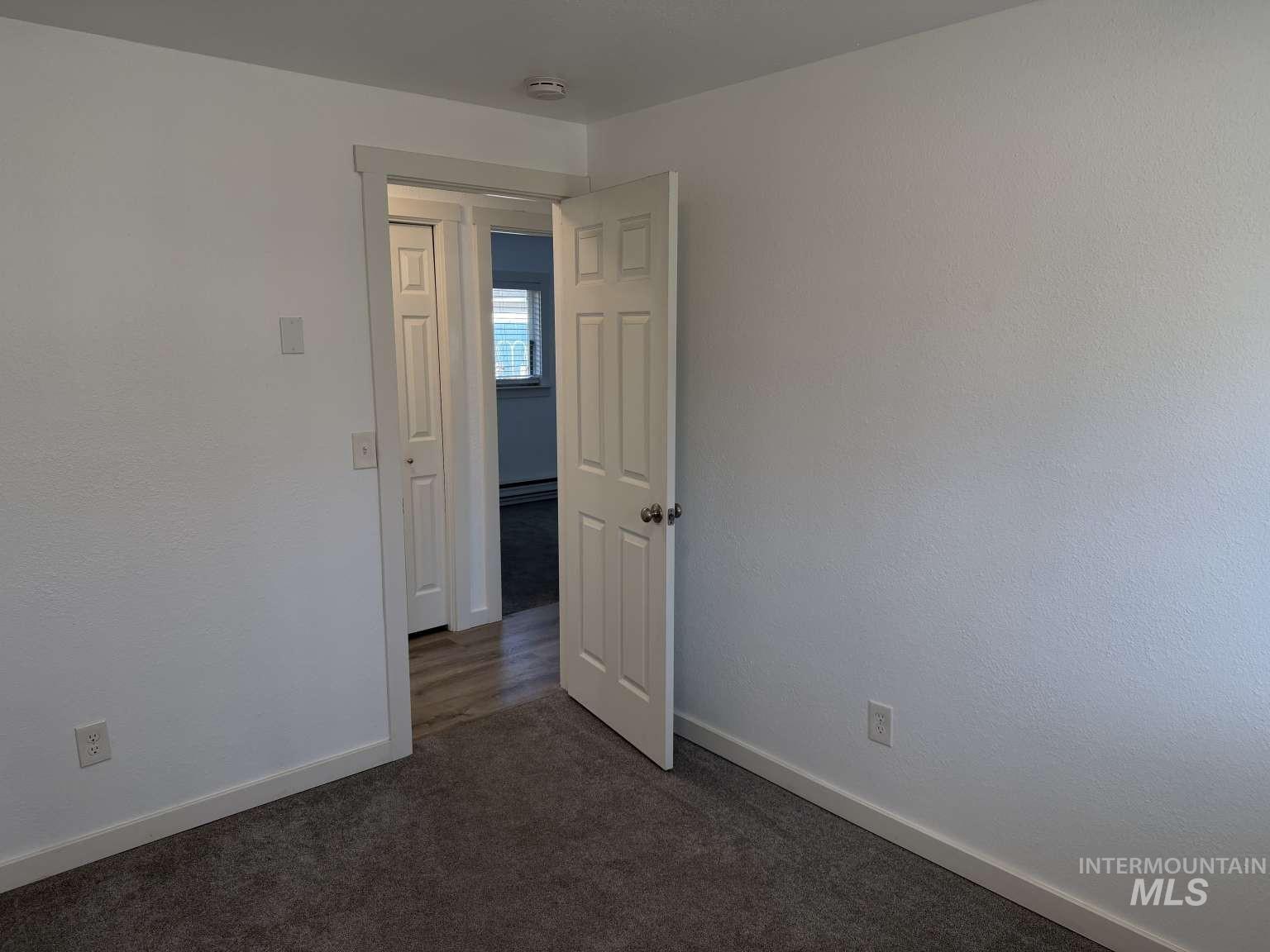 211 Jasper Avenue Middleton, ID 83644 - Photo 12 of 25 Spare room with baseboards and dark carpet