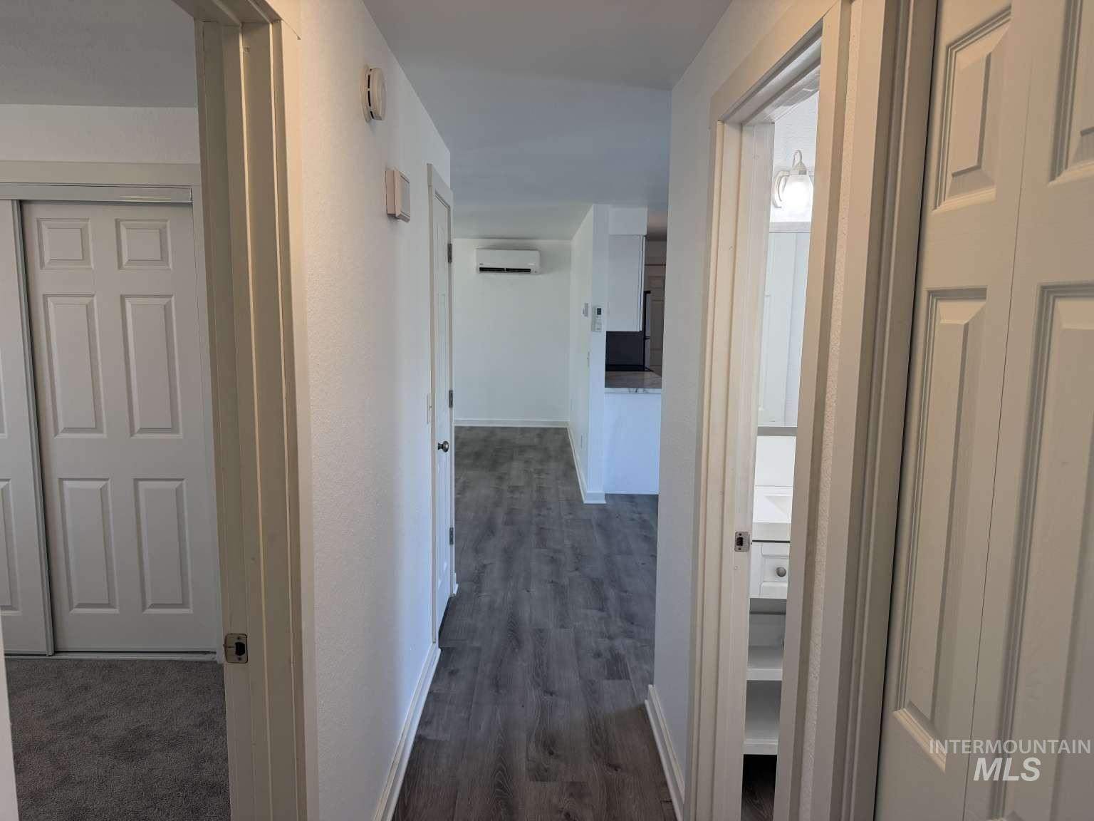211 Jasper Avenue Middleton, ID 83644 - Photo 15 of 25 Hall with dark wood finished floors and a wall mounted mini split