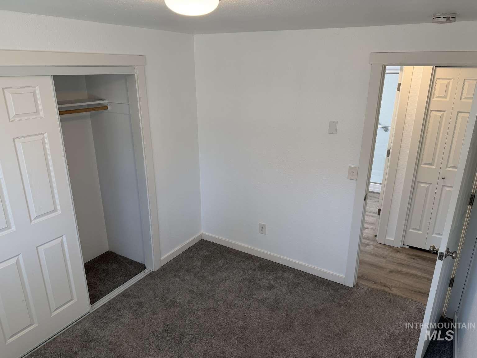 211 Jasper Avenue Middleton, ID 83644 - Photo 10 of 25 Unfurnished bedroom with a closet and dark colored carpet