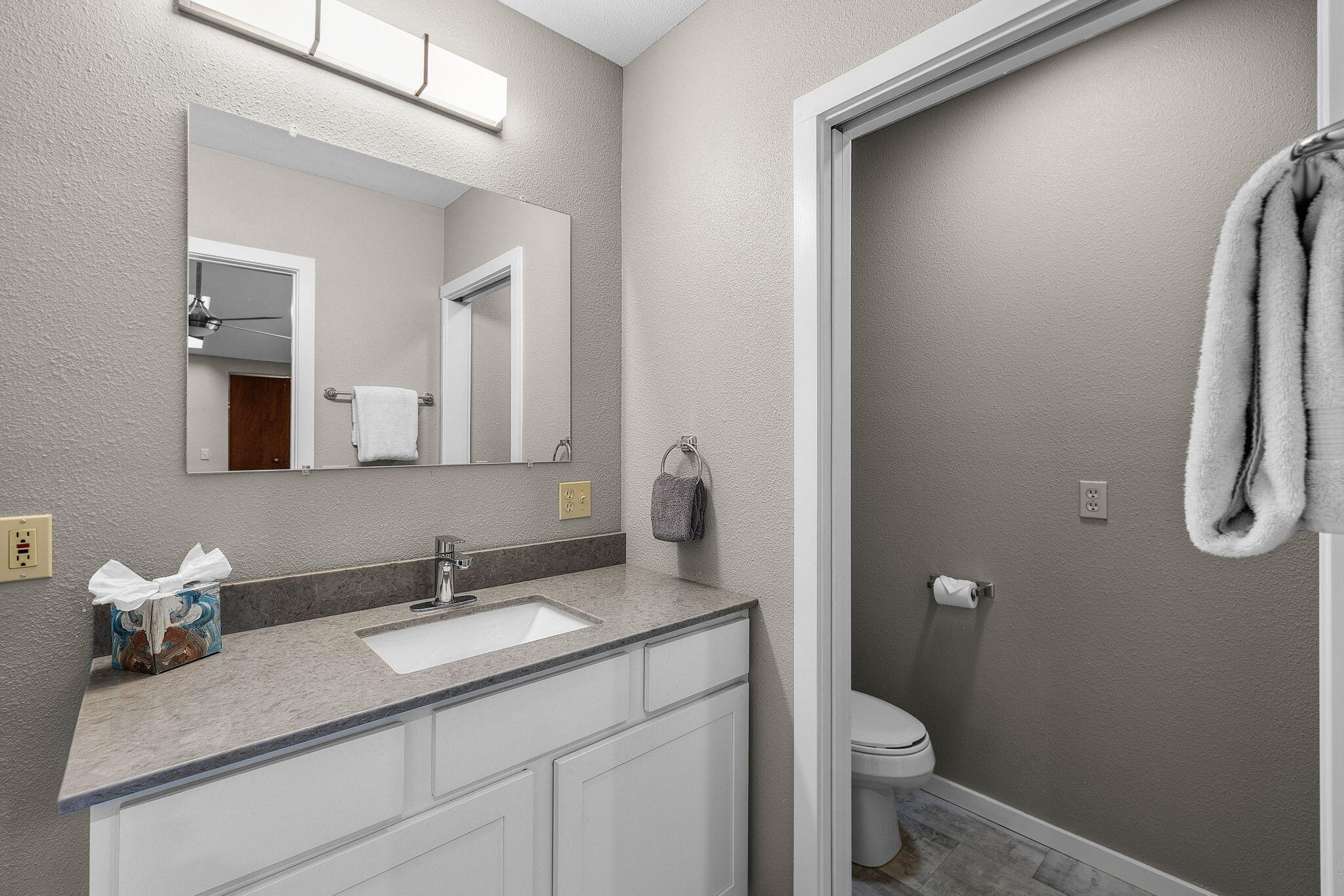 13168 Hawks Beard Black Butte Ranch, OR 97759 - Photo 21 of 47 a bathroom with a granite countertop sink toilet and mirror