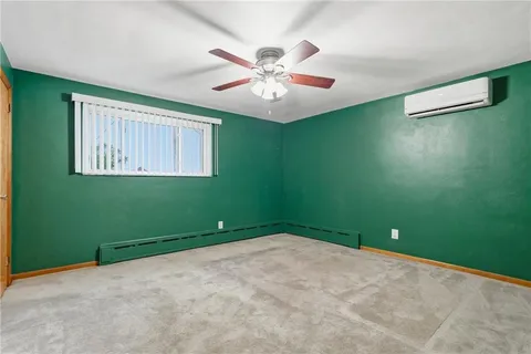 a view of a room with a fan and a window