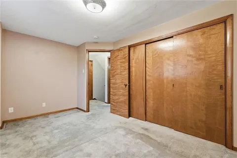 a view of an empty room with a large window