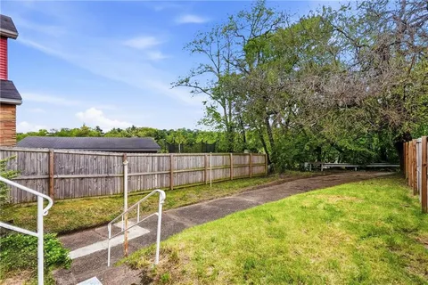 a view of a backyard with a small cabin