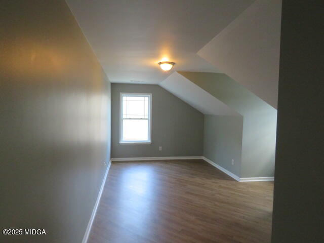 776 Ivy Brook Way Macon, GA 31210 - Photo 13 of 21 an empty room with wooden floor and windows