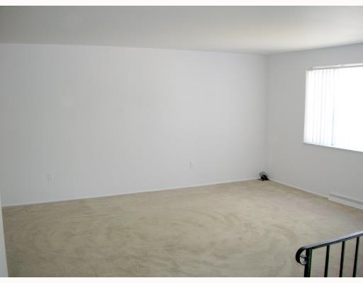137 Parkedge Road Green Tree, PA 15220 - Photo 3 of 8 Living Room. Large living room with beige carpeting and freshly-painted white walls.