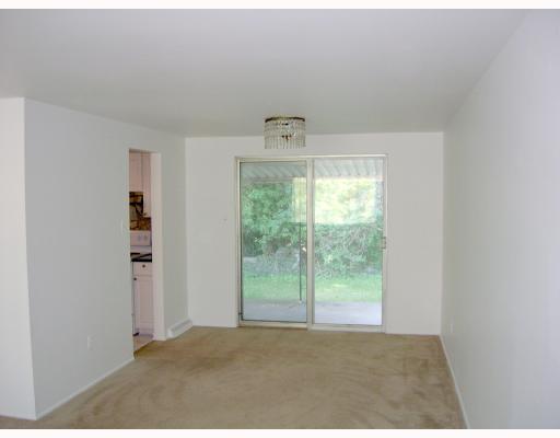 137 Parkedge Road Green Tree, PA 15220 - Photo 4 of 8 Dining Room. Dining Room with beige carpeting, freshly-painted white walls, crystal light fixture, and sliding glass doors to covered patio.