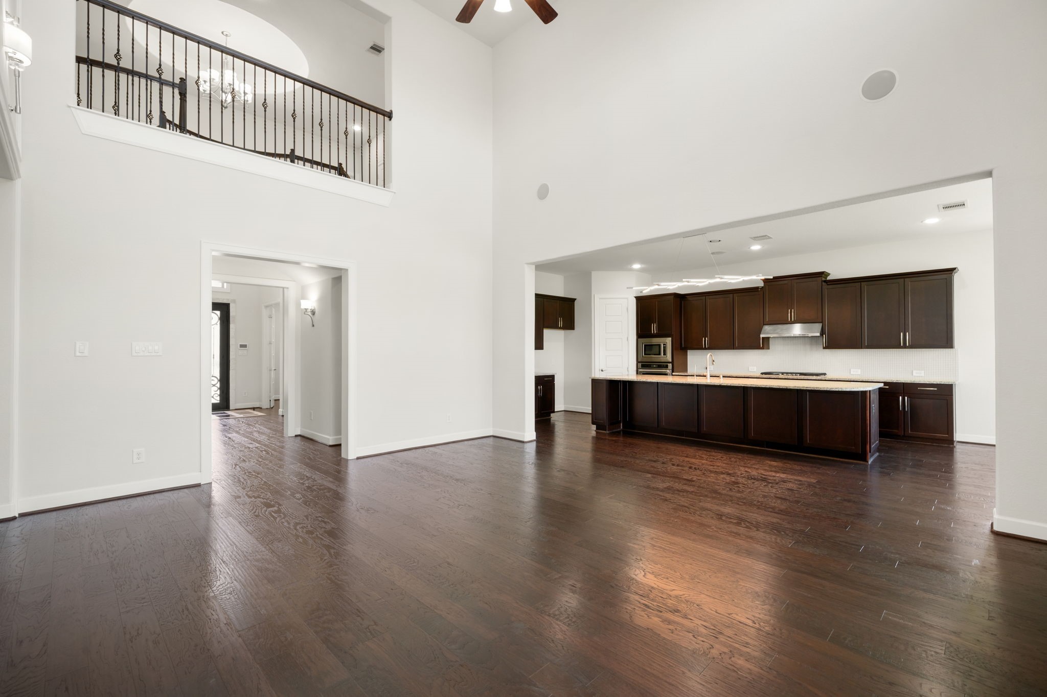 3622 Sage Hollow Drive Spring, TX 77386 - Photo 10 of 46 Designed for seamless high-end entertaining, the family room flows directly into the gourmet kitchen, maintaining open sightlines beneath the second-story overlook.