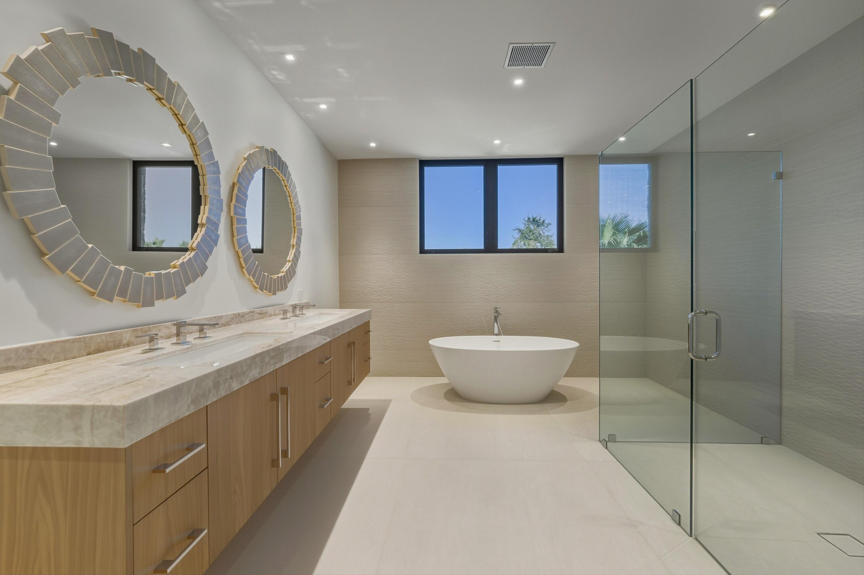 52637 Meriwether Way La Quinta, CA 92253 - Photo 11 of 15 a spacious bathroom with a double vanity sink mirror and bathtub