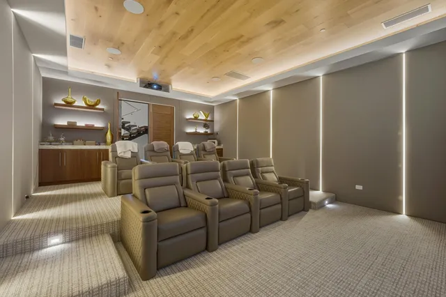 a living room with furniture and a entryway