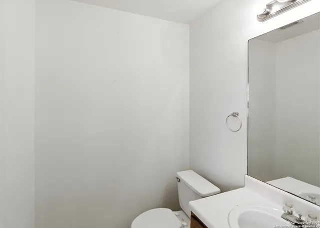 a bathroom with a toilet and sink