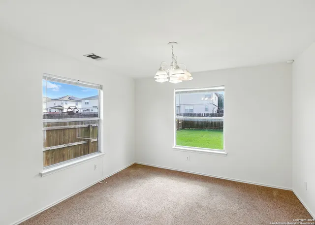 an empty room with windows