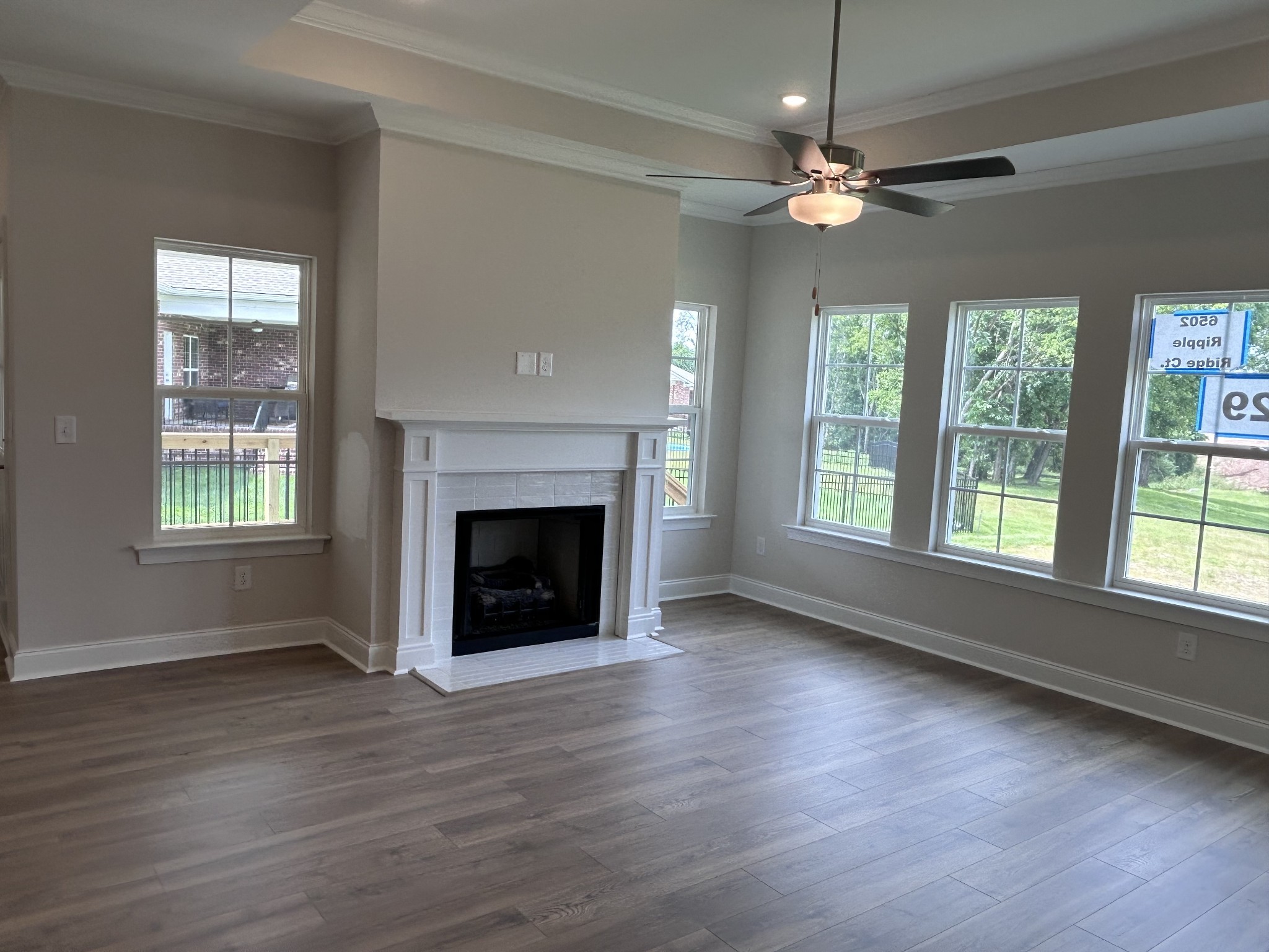 6502 Ripple Ridge Columbia, TN 38401 - Photo 14 of 52 a view of an empty room with wooden floor fireplace and a window