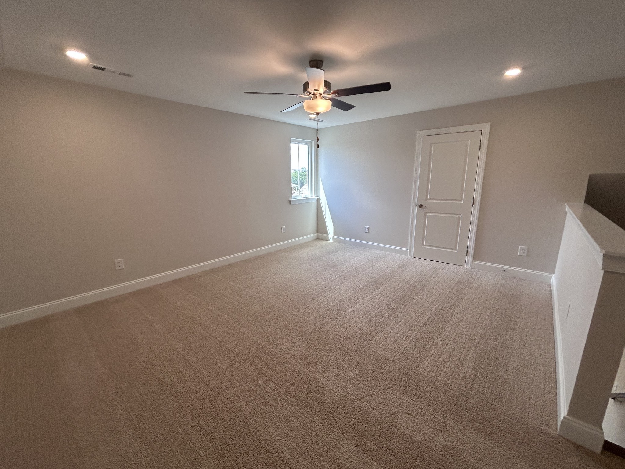 6502 Ripple Ridge Columbia, TN 38401 - Photo 41 of 52 an empty room with a window and a chandelier fan