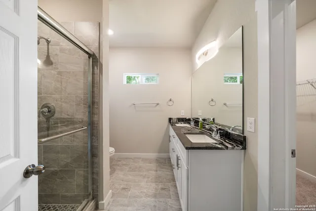 a bathroom with a shower and a toilet