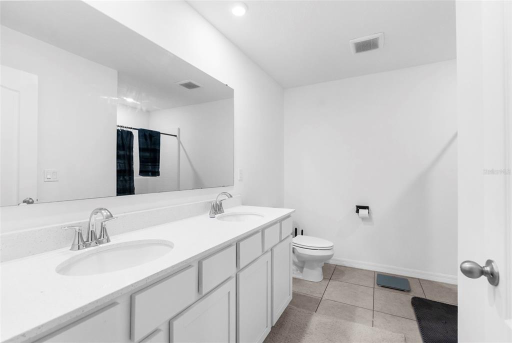 5637 East Tangelo Lane Inverness, FL 34453 - Photo 20 of 23 a bathroom with a sink double vanity and a toilet