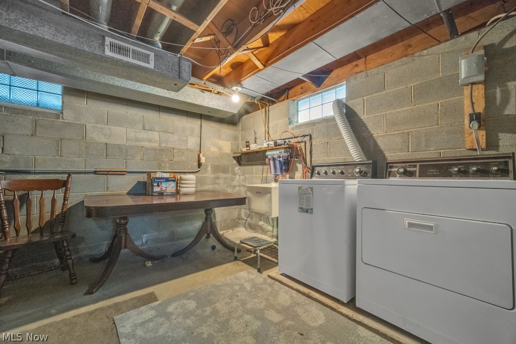 6846 Revere Road Cleveland, OH 44130 - Photo 26 of 30 Below grade area with washing machine and dryer