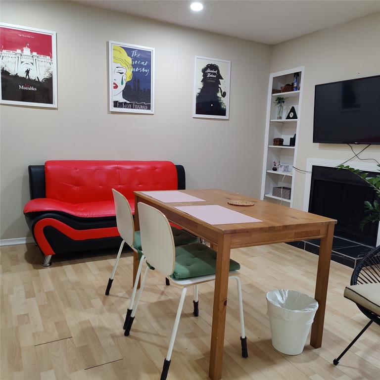 18333 Roehampton Drive Dallas, TX 75252 - Photo 2 of 10 a view of a livingroom with furniture and a flat screen tv