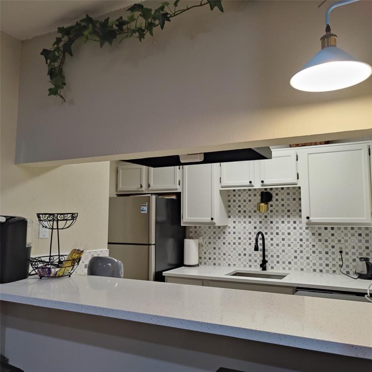 18333 Roehampton Drive Dallas, TX 75252 - Photo 4 of 10 a bathroom with a sink and a mirror