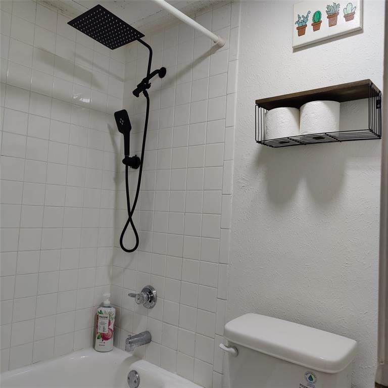 18333 Roehampton Drive Dallas, TX 75252 - Photo 6 of 10 a bathroom with a toilet and a shower