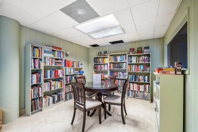a view of a livingroom with furniture and bathroom